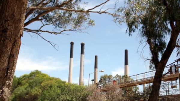 Smoke stacks at Alcoa's Kwinana alumina refinery in WA.